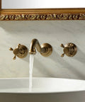 Antique Brass Bathroom Sink Faucet Set With Ceramic Disc Valve, Widespread Design, water flowing from faucet with two cross handles