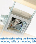 Fire-Rated Exhaust Bath Fan With 50 CFM And 3.0 Sones, White Finish shown during ceiling installation with mounting rails