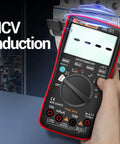 Bluetooth Digital Multimeter With Auto Range TRMS 6000 Counts displaying NCV induction feature in hand view.