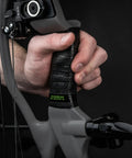 Hand gripping bow wrapped with Archery Grip Tape Version 2 Pro For A Steady Grip In Wet Or Dry Conditions Two Wrap Pack