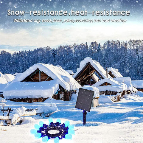 Snowy village scene with solar panel and string lights, showcasing Solar Powered Outdoor String Lights 27ft RGB Color Changing.