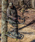 Hunter using Titan Sd Climbing Treestand With Roomier Design Bigger Top Seat Frame And Longer Foot Platform, 350 lb capacity