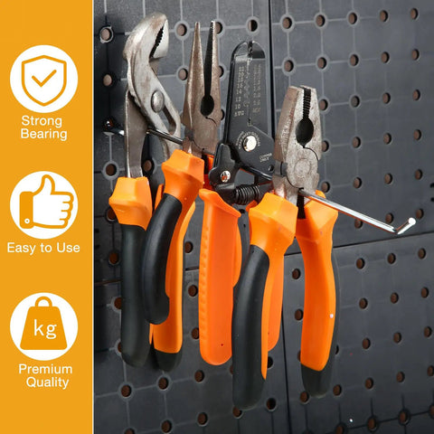100 Pack Stainless Steel Pegboard Hooks For One Eighth And One Quarter Inch Pegboards holding tools on a black board