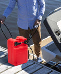 Man using 6 Gallon Marine Portable Boat Gas Tank With I Shaped Handle Rugged Built In Filter Fuel Level Indicator Sealing And Venting Modes For Safe Outboard Refueling on dock