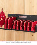 Shop Tested Street Smart Radius And Chamfer Quick Jig Deluxe Set Featuring 18 Router Table Templates organized on a wall rack.