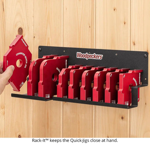 Shop Tested Street Smart Radius And Chamfer Quick Jig Deluxe Set Featuring 18 Router Table Templates organized on a wall rack.