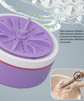 Portable Mini Washing Machine USB Powered Compact Clothes Washer Adjustable Timer For Delicates Underwear Produce And Dishes Purple top view with water droplets.