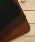Premium Leather Extended Mouse Pad For Office And Gaming, showcasing three colors, non-slip base, close-up on wooden surface.