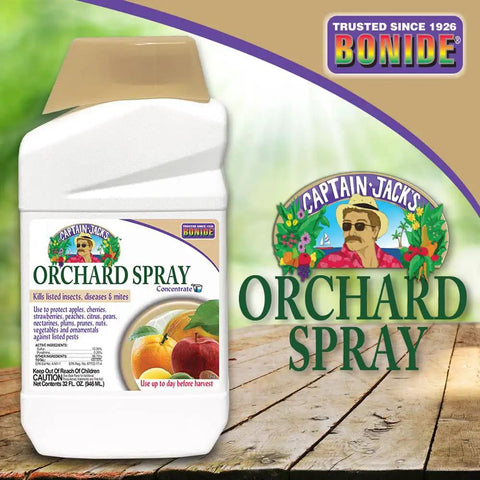 Captain Jack's Orchard Spray bottle on wooden table with product label and logo, 32 oz concentrate for garden pest control.