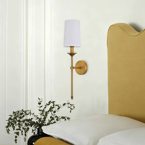 Top Shelf Vintage Antique Brass Wall Sconce Set Of 2 Hardwired Farmhouse Lights With Smooth White Glass Shades next to a yellow headboard.