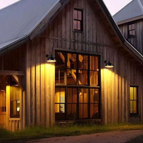 Solar Barn Light For Outdoor Use Dusk To Dawn Outdoor Wall Sconce With Solar Power No Wiring Hassel Rustic Industrial Exterior Lighting For Garage Shed Farmhouse Look illuminating a rustic barn exterior at sunset.