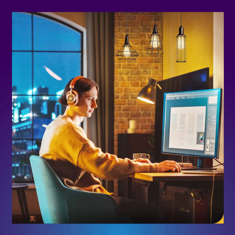 Person at desk with computer screen, Smart Edison Bulbs Tunable Dimmable 2700K to 6500K Amber Warm and Cool White WiFi E26 LED Filament