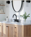Matte Black 4 Inch Centerset Two Handle Bathroom Faucet With 360 Degree Swivel Spout For Two Or Three Hole Vanities installed on a marble vanity top.