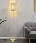 Gold Crystal Floor Lamp With On Off Foot Switch beside gray sofa in living room, featuring gold crystal shade and sturdy base.