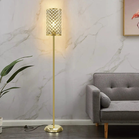 Gold Crystal Floor Lamp With On Off Foot Switch beside gray sofa in living room, featuring gold crystal shade and sturdy base.