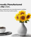 Sunflowers in a vase next to a bowl of capsules, with text highlighting USA manufacturing of supplements.