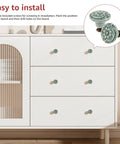 Slick Green Ceramic Cabinet Knobs, Retro Drawer Pulls for Kitchen Cabinets and Dressers on a white dresser, 34mm diameter.