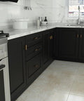 Modern kitchen with black cabinets featuring Hot Brushed Gold Cabinet Knobs Set 50 Pack Stainless Steel Drawer Pull Handles.