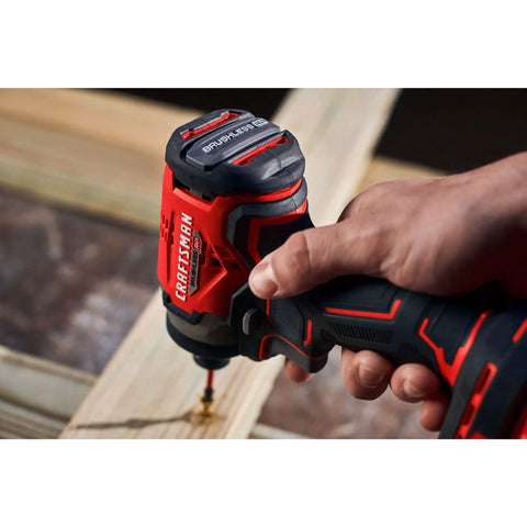 Close-up of V20 Cordless Drill And Impact Driver Combo Kit With Brushless Motors in use on wood, heavy duty power tool visible