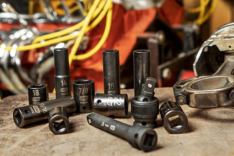 44 Piece 1/2 Inch Drive Impact Socket Set With Standard And Deep SAE/MM Sockets, tools arranged on workshop table