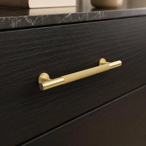 Top Shelf Solid Brass Cabinet Pulls With Slick Grooved Grip Design For No Sweat Installation on dark drawer front.