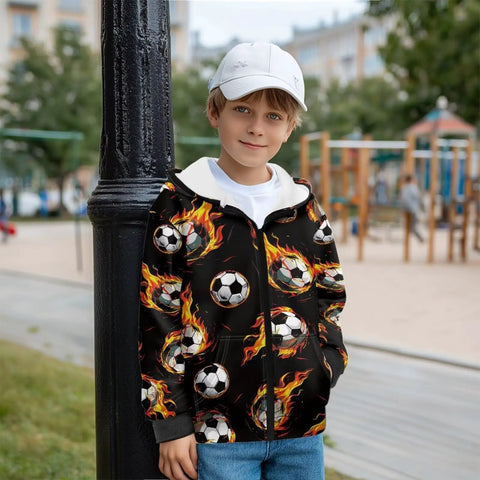 Boy wearing Boys Flame Soccer Print Full Zip Hoodie for winter running and morning recess, standing outdoors.