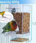 Total Game Changer For Pet Parents Seeking Spill Proof Auto Bird Feeder Cage Dish Made From Heavy Duty Clear Acrylic with a cockatiel
