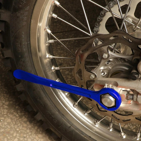 Universal Motorcycle Tire Change Kit With 10mm To 32mm Hex Wrench Levers attached to bike wheel for repair