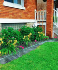 Garden bed with 17 Inch Wide By 50 Feet Long Heavy Duty Landscape Fabric Weed Barrier Woven Geotextile Ground Cover For Under Gravel.