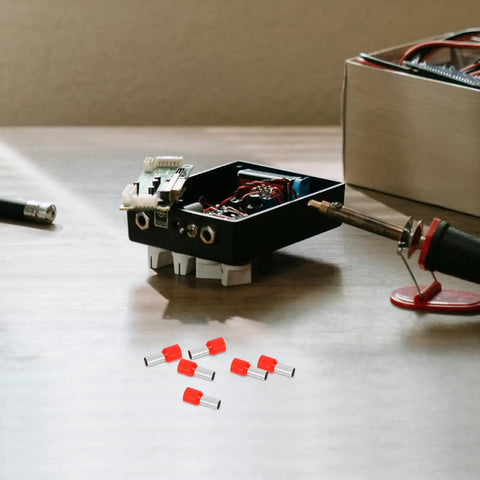 Kick The Butt Out Of Wiring With 100pcs Red Ferrule Terminals Kit Featuring Durable Stainless Steel And Plastic To Stop Leakage, Boost Safety, And Nail Perfect Electrical Connections For Big Projects Today. Red ferrule terminals kit on workbench for wire connections