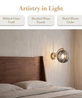 Mid‑Century Modern Globe Glass Wall Sconce with Wine Red Hand‑Blown Glass mounted beside a wooden bed, highlighting ribbed glass.
