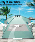 Deluxe XL Pop Up Beach Tent Sun Shade For 3 To 4 People With UV Protection and windows on sandy beach, mint green