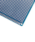 Close-up of blue double-sided PCB from 38-Piece Double-Sided PCB Board Prototype Kit with 5 sizes, 4 colors, FR4 1.6mm thick.