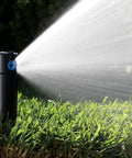 Adjustable Six Inch Pop Up Rotor Sprinkler Head For Lawns And Yards, 50 To 360 Degree Arc, Three Quarters Inch Inlet, spraying water