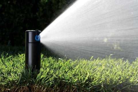 Adjustable Six Inch Pop Up Rotor Sprinkler Head For Lawns And Yards, 50 To 360 Degree Arc, Three Quarters Inch Inlet, spraying water