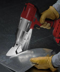 Heavy Hitter Brushless Cordless Metal Shear Fits Milwaukee 18V Battery cutting through sheet metal with precision.