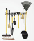 Heavy Duty Garage Wall Organizer Rack With 48 Inch Steel Beam And Rock Solid 280 Lb Load Capacity Featuring Eighteen Versatile Storage Hooks holding various cleaning tools and shovels.