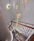Elegant staircase with intricate railing, showcasing modern light fixture, Flat Base Baluster Shoes For Half Inch Square Railings With Screws Satin Black Finish Set Of 30 Easy Install No Frills Look For Stairs And Railings Hide Gaps And Defects While Providing Durable Support And Clean Modern Look.
