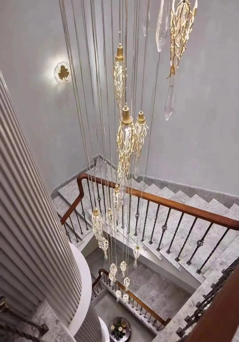 Elegant staircase with intricate railing, showcasing modern light fixture, Flat Base Baluster Shoes For Half Inch Square Railings With Screws Satin Black Finish Set Of 30 Easy Install No Frills Look For Stairs And Railings Hide Gaps And Defects While Providing Durable Support And Clean Modern Look.