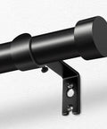 Close-up of Adjustable Black Curtain Rod From 32 To 144 Inches Heavy Duty 1 Inch Curtain Rods For Windows with secure bracket.