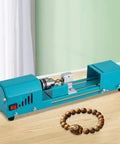 Ridiculously Tight Compact Mini Lathe Machine With 150W Powerful Motor For Wood Beading Polishing And Precision Carving Hitting 9000 Rpms on workbench.