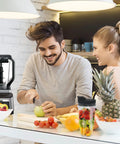 Couple preparing fruit with 2 Pack 24 Oz Blender Cups With Lids And Cup Brush For Auto IQ Blenders Fits Models BL450 BL454 BL456