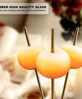 Three Light Floor Lamp With Gold Plated Tripod Stand Modern Amber Glass Lampshade close-up with gold rods
