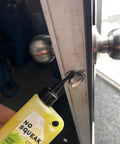 Applying high performance penetrating oil for bike chain lubrication door hinges and locks rust removal to door lock