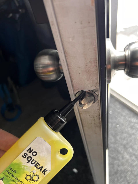 Applying high performance penetrating oil for bike chain lubrication door hinges and locks rust removal to door lock