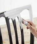 Applying Ultra Bond Adhesion Primer for Interior and Exterior Surfaces, High-Tack Formula on black chair, 1 Quart.