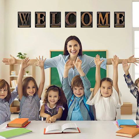 Fresh Industrial Chic Bulletin Board Poster Set Leveling Up Classroom Vibe With Seven Welcome Cutouts And Six Motivational Prints Perfect Teacher Decor Game Changer Glue Dots Included, students and teacher in classroom smiling with 'WELCOME' display.