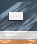 Modern Edge Quad Toggle Wall Plate White For Switches And Outlets Durable Zinc Alloy Decor Cover Heavy Duty Easy Install 8.6 Inch Long By 4.9 Inch Wide installed on a blue wall