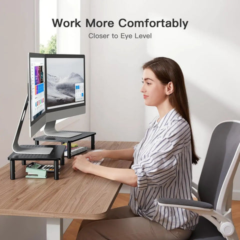 Dual Monitor Desk Stand With Height Adjustable Riser Laptop And Monitor Stand For Two Screens 14.5 By 9.1 Platform Under Desk Storage Black Two Pack Ergonomic Setup displayed with monitors and laptop.