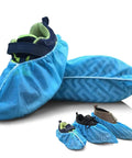 Disposable Kids Shoe Covers Non Slip Blue 50 Pack 25 Pairs Stretchable Nonwoven Fabric Durable for US Children Size 8 to 13.5 1 to 4 Easy On Breathable Soft Comfort Dustproof Kid Friendly Fit covering shoes on white background